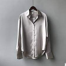 Load image into Gallery viewer, A timeless classic blouse made from the finest silk. Featuring a luxe gray satin fabric, a loose fit and button up front - this shirt can be styled up or down whatever the occasion. Team it with some high waist pants and strappy heels for a must have look.