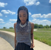 Load image into Gallery viewer, Feel cute and cozy, with this Shine Bright knitted camisole sweater will get the job done. Featuring a soft and stretchy sequin knitted fabric and sleeveless. Style with our "Swing It Baby Shorts" or jeans and high heels for a complete look.