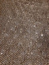 Load image into Gallery viewer, Feel cute and cozy, with this Shine Bright knitted camisole sweater will get the job done. Featuring a soft and stretchy sequin knitted fabric and sleeveless. Style with our "Swing It Baby Shorts" or jeans and high heels for a complete look.