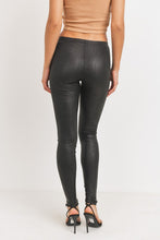 Load image into Gallery viewer, Every fashionista knows she must have a pair of faux snake skin leather leggings in her fall fashion wardrobe. Featuring a high fashion faux leather fabric and body sculpting fit. Make these pants this seasons go-to when dressing them up with your favorite pieces from home!