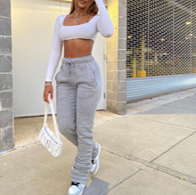Load image into Gallery viewer, High Waisted Stacked Sweatpants - Heather Grey  Upgrade your casual look this season with these stacked sweatpants. These sweatpants come different colors. Featuring elastic waist band and two deep side pockets, drawstring for a comfortable stretch. You can style with a simple bodysuit or T- Shirt to complete the look.
