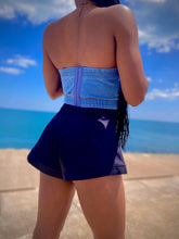 Load image into Gallery viewer, We're bringing the heat with these flowy swing it baby shorts! Great for day parties with your girls or even a night out with your bae! These shorts come in a soft black material, front zip and button closure. Style these sexy shorts with a white bodysuit or a rhinestone denim corset, simple high heels and handbag for a complete look!