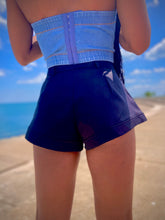 Load image into Gallery viewer, We're bringing the heat with these flowy swing it baby shorts! Great for day parties with your girls or even a night out with your bae! These shorts come in a soft black material, front zip and button closure. Style these sexy shorts with a white bodysuit or a rhinestone denim corset, simple high heels and handbag for a complete look!