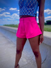 Load image into Gallery viewer, We're bringing the heat with these flowy swing it baby shorts! Great for day parties with your girls or even a night out with your bae! These shorts come in a soft hot pink material, front zip and button closure. Style these sexy shorts with a white bodysuit or a rhinestone denim corset, simple high heels and handbag for a complete look!