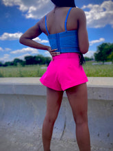Load image into Gallery viewer, We're bringing the heat with these flowy swing it baby shorts! Great for day parties with your girls or even a night out with your bae! These shorts come in a soft hot pink material, front zip and button closure. Style these sexy shorts with a white bodysuit or a rhinestone denim corset, simple high heels and handbag for a complete look!