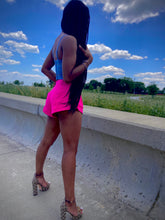 Load image into Gallery viewer, We're bringing the heat with these flowy swing it baby shorts! Great for day parties with your girls or even a night out with your bae! These shorts come in a soft hot pink material, front zip and button closure. Style these sexy shorts with a white bodysuit or a rhinestone denim corset, simple high heels and handbag for a complete look!