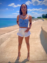 Load image into Gallery viewer, We're bringing the heat with these flowy swing it baby shorts! Great for day parties with your girls or even a night out with your bae! These shorts come in a soft white material, front zip and button closure. Style these sexy shorts with a rhinestone denim corset, simple high heels and handbag for a complete look!