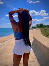 Load image into Gallery viewer, We're bringing the heat with these flowy swing it baby shorts! Great for day parties with your girls or even a night out with your bae! These shorts come in a soft white material, front zip and button closure. Style these sexy shorts with a rhinestone denim corset, simple high heels and handbag for a complete look!