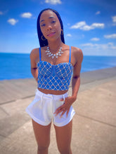 Load image into Gallery viewer, We're bringing the heat with these flowy swing it baby shorts! Great for day parties with your girls or even a night out with your bae! These shorts come in a soft white material, front zip and button closure. Style these sexy shorts with a rhinestone denim corset, simple high heels and handbag for a complete look!