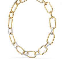 Load image into Gallery viewer, A celebration of femininity and modern design, this Swarovski necklace draws inspiration from the hardware trend. Two elongated chain links holding onto each other – one shimmering softly, one covered in clear crystal pavé – take center stage.
