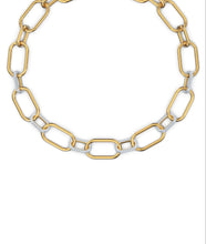 Load image into Gallery viewer, A celebration of femininity and modern design, this Swarovski necklace draws inspiration from the hardware trend. Two elongated chain links holding onto each other – one shimmering softly, one covered in clear crystal pavé – take center stage.