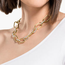 Load image into Gallery viewer, A celebration of femininity and modern design, this Swarovski necklace draws inspiration from the hardware trend. Two elongated chain links holding onto each other – one shimmering softly, one covered in clear crystal pavé – take center stage.