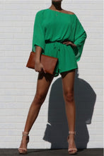 Load image into Gallery viewer, This Money Bag romper is a must have for the new season babe! Easy to style and perfect for multiple occasions. This romper comes fully lined in a green mesh material and elasticized waistband. Style with a high heel, gold accessories and woven clutch bag for a weekend look you'll adore.