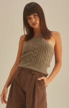Load image into Gallery viewer, Get in touch with your wardrobe this season with this cute kitted sweater. Featuring a moss green hue twisted cable knit material with a cropped fit, asymmetrical shoulder cut-out adds a flirty touch. It's super soft with the right amount of stretch we're in love. Pair this with your favorite high rise denim jeans, high heels or boots and gold hoop earrings for an effortless vibe.
