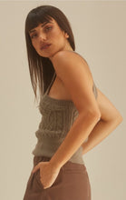 Load image into Gallery viewer, Get in touch with your wardrobe this season with this cute kitted sweater. Featuring a moss green hue twisted cable knit material with a cropped fit, asymmetrical shoulder cut-out adds a flirty touch. It's super soft with the right amount of stretch we're in love. Pair this with your favorite high rise denim jeans, high heels or boots and gold hoop earrings for an effortless vibe.