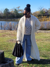 Load image into Gallery viewer, Embrace your cozy & stylish side, a piece that will have you looking and feeling great. Made with the highest quality material, this sweater has a stretchy and soft feel to it. This sweater pairs well with denim, and also provides a unique look when worn with leggings or pants. Pair with pumps and gold accessories for a chic look or jazz it up with flats and hoops during the day!