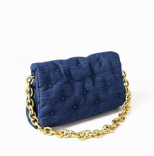 Load image into Gallery viewer, This Denim shoulder bag is an essential for your wardrobe girl. Versatile and great for all seasons! Featuring a denim fabric, quilted design, fold over detail, snap closure and thick gold chain handle. Pair with your outfit of the day to complete your look.