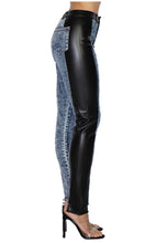 Load image into Gallery viewer, Jeans are a must, add some edge to your look in these vegan leather denim pants. Great for dressing up and down! These jeans come in a high-rise fit featuring a mid wash denim material and vegan leather side detail. Make a statement with a super stylish top and high heels for a look we love!