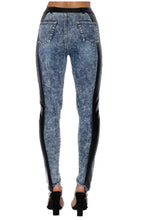 Load image into Gallery viewer, Jeans are a must, add some edge to your look in these vegan leather denim pants. Great for dressing up and down! These jeans come in a high-rise fit featuring a mid wash denim material and vegan leather side detail. Make a statement with a super stylish top and high heels for a look we love!