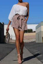 Load image into Gallery viewer, We’re loving this sexy and classy walk the walk one shoulder romper. Featuring a wrap detail, elasticized detail, and a tie belt. Style this ultra chic romper with a statement heel, handbag and gold accessories to have all eyes on you!