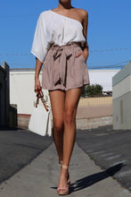 Load image into Gallery viewer, We’re loving this sexy and classy walk the walk one shoulder romper. Featuring a wrap detail, elasticized detail, and a tie belt. Style this ultra chic romper with a statement heel, handbag and gold accessories to have all eyes on you!