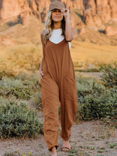 Load image into Gallery viewer, This Sunrise jumpsuit features a striking V- neckline, pockets and lots of stretch for added comfort, this full-size sleeveless jumpsuit comes in a variety of colors. Our Sunrise jumpsuit is stylish, comfortable and its lightweight fabric makes it ideal for summer or fall events, such as brunch or a family BBQ. Style with a bag and your favorite sandals for a complete look.