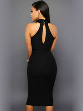 Load image into Gallery viewer, Our gorgeous Grecian Cutout Dress is sure to make heads turn the sheer V-cut stand out, offering a lush look with the cross neckline. Pair this dress with a yellow or pink colored bag for a pop of color and you’re ready for a night on the town.