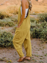 Load image into Gallery viewer, This Sunrise romper features a striking V- neckline, pockets and lots of stretch for added comfort, this full-size sleeveless jumpsuit comes in a variety of colors. Our Sunrise jumpsuit is stylish, comfortable and its lightweight fabric makes it ideal for summer or fall events, such as brunch or a family BBQ. Style with a bag and your favorite sandals for a complete look.