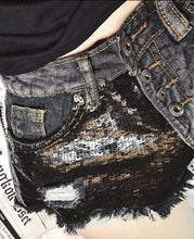 Load image into Gallery viewer, These Black Diamond Sequin are essential for the summer and you need them in your closet! Featuring a frayed hem, black denim material and sequence fabric; what's not to love!? Style with our yellow sneak peak crop top and gold accessories for a complete look!