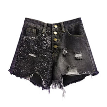 Load image into Gallery viewer, These Black Diamond Sequin are essential for the summer and you need them in your closet! Featuring a frayed hem, black denim material and sequence fabric; what's not to love!? Style with our yellow sneak peak crop top and gold accessories for a complete look!