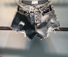 Load image into Gallery viewer, These Black Diamond Sequin are essential for the summer and you need them in your closet! Featuring a frayed hem, black denim material and sequence fabric; what's not to love!? Style with our yellow sneak peak crop top and gold accessories for a complete look!