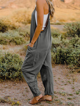 Load image into Gallery viewer, This Sunrise jumpsuit features a striking V- neckline, pockets and lots of stretch for added comfort, this full-size sleeveless jumpsuit comes in a variety of colors. Our Sunrise jumpsuit is stylish, comfortable and its lightweight fabric makes it ideal for summer or fall events, such as brunch or a family BBQ. Style with a bag and your favorite sandals for a complete look.