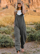 Load image into Gallery viewer, This Sunrise jumpsuit features a striking V- neckline, pockets and lots of stretch for added comfort, this full-size sleeveless jumpsuit comes in a variety of colors. Our Sunrise jumpsuit is stylish, comfortable and its lightweight fabric makes it ideal for summer or fall events, such as brunch or a family BBQ. Style with a bag and your favorite sandals for a complete look.