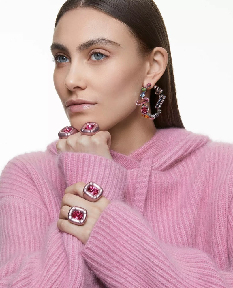 Featuring a mix of dazzling, precision-cut crystals arranged in a random formation, these hoop earrings are an elegant yet playful twist on the essence of Swarovski crystals. Whether worn alone, they make a joyful statement however you choose to style them.