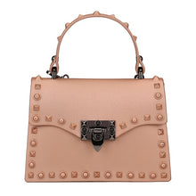 Load image into Gallery viewer, Are you ready to make a statement, babe? This rubberized trendy bag features a soft matte sage finish, studded detailing, gunmetal hardware with a locking clasp, a roomy interior compartment and also includes a crossbody strap. It's time to bring some edge and ambition to your look, sis!