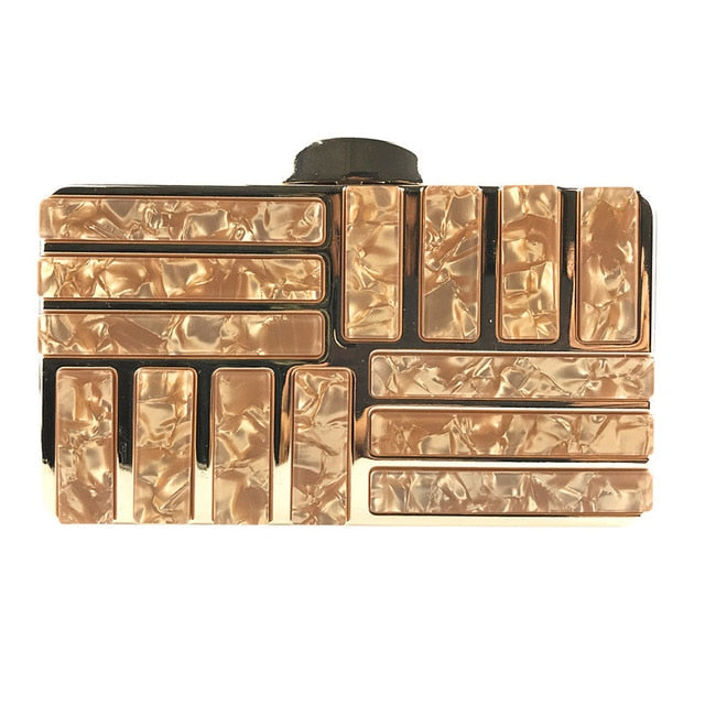 This marble acrylic clutch is elegant, glamorous and fashionable. A stylish and convenient addition to your accessory collection. With room for all your must-have gizmos, this rectangular purse has a removable crossbody strap and gold hardware.  Great present for your friend, your family or yourself. This unique & beautiful design will make you shine.