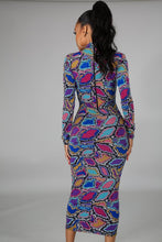 Load image into Gallery viewer, Colorful Jungle Body Dress Dress - Multi Color Keep it comfy but chic in this sexy bodycon snake print dress. Not only is this dress versatile and easy to dress up or down it's also reversible too! This dress comes in a mini length featuring a crewneck neckline and long sleeve. Pair this with a pair of ankle boots for a casual look or high heels and handbag to dress it up!