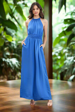 Load image into Gallery viewer, The Above All High Jumpsuit is a sleek and sophisticated fashion staple. Its high neckline adds an element of chic elegance, while the sleeveless design keeps it modern and versatile. Whether you&#39;re dressing up for a formal event or looking for a stylish ensemble for a night out, this jumpsuit offers a timeless and fashionable look that effortlessly combines grace and confidence.
