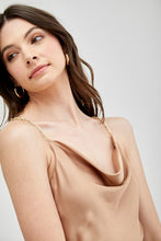 Load image into Gallery viewer, Our Above Status Satin Jumpsuit perfect blend of sophistication and texture that adds a touch of elegance to your wardrobe. This satin jumpsuit features a cowl neck design with intricate trim detailing, meticulously woven to create a unique and visually captivating ensemble.
