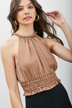 Load image into Gallery viewer, The Good Life Smocked Waist Satin Crop Top is a wardrobe staple you&#39;ll turn to again and again. Constructed from soft breathable satin feel material, this unique toffee color blouse can be styled with black slacks or jeans for any event, from happy hour to lunch. Finish off the look with a stylish bag and cute gold earrings.
