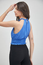 Load image into Gallery viewer, The Good Life Smocked Waist Satin Crop Top is a wardrobe staple you&#39;ll turn to again and again. Constructed from soft breathable satin feel material, this unique blue azure or papaya color blouse can be styled with black slacks or jeans for any event, from happy hour to lunch. Finish off the look with a stylish bag and cute gold earrings.
