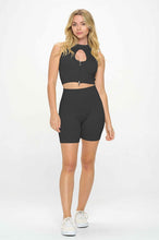 Load image into Gallery viewer, Elevate your workout style in our sexy women&#39;s two- piece ribbed seamless sleeveless banded crop tank top and biker shorts set, our two- piece set comprised of sleeveless crop tank top with a cute front zipper band and biker shorts.
