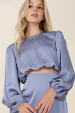 Load image into Gallery viewer, Feeling You Satin Two-Piece Mermaid set is a sexy ensemble that will make you look and feel beautiful. The stylish crop top feature a boat neckline and long puff sleeves, it comes with a matching skirt that feature a side zipper closures for easy wear. This unique mermaid design is available in two colors, pair it with heels and a statement clutch for Sunday Funday, or wear it to your next happy hour.

