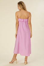 Load image into Gallery viewer, You’ve got us under your spell. Lilac Regal Bohemian Ruffle Maxi Dress is a full skirted maxi dress complete with adjustable spaghetti straps. It’s the vacation ready frock that will transition easily from your bikini coverup to your happy hour outfit. Complete the look with barely there heels, a sleek low bun, and hoops.
