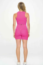 Load image into Gallery viewer, Elevate your workout style in our sexy women&#39;s two- piece ribbed seamless sleeveless banded crop tank top and biker shorts set, our two- piece set comprised of sleeveless crop tank top with a cute front zipper band and biker shorts.

