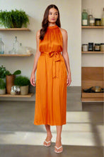 Load image into Gallery viewer, This Summer Lucy Paris dress is made with love for nice sunny days! This is a statement making dress, it has a soft satin feel fabric. Our Lucy Paris sleeveless dress featuring a round neck button collar, with an open back sexy detail, the belt gives it a cute feminine look. You will be sure to turn heads throughout your day at any event. Pair with heels, and your gold accessories.
