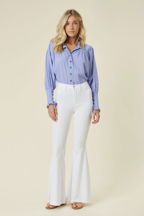 Make a fashion statement in our Vibrant M.i.U High Waisted Flare White Jeans. This jean comes in an extreme flare fit featuring two back patch pockets, faux front pockets, light frayed bottom hem, and a zip-fly closure. Style these jeans with a statement top and a high heel for a look that will have everyone talking.