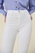 Load image into Gallery viewer, Make a fashion statement in our Vibrant M.i.U High Waisted Flare White Jeans. This jean comes in an extreme flare fit featuring two back patch pockets, faux front pockets, light frayed bottom hem, and a zip-fly closure. Style these jeans with a statement top and a high heel for a look that will have everyone talking.
