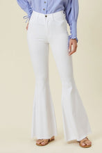 Load image into Gallery viewer, Make a fashion statement in our Vibrant M.i.U High Waisted Flare White Jeans. This jean comes in an extreme flare fit featuring two back patch pockets, faux front pockets, light frayed bottom hem, and a zip-fly closure. Style these jeans with a statement top and a high heel for a look that will have everyone talking.
