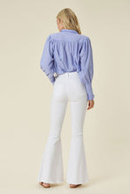 Load image into Gallery viewer, Make a fashion statement in our Vibrant M.i.U High Waisted Flare White Jeans. This jean comes in an extreme flare fit featuring two back patch pockets, faux front pockets, light frayed bottom hem, and a zip-fly closure. Style these jeans with a statement top and a high heel for a look that will have everyone talking.
